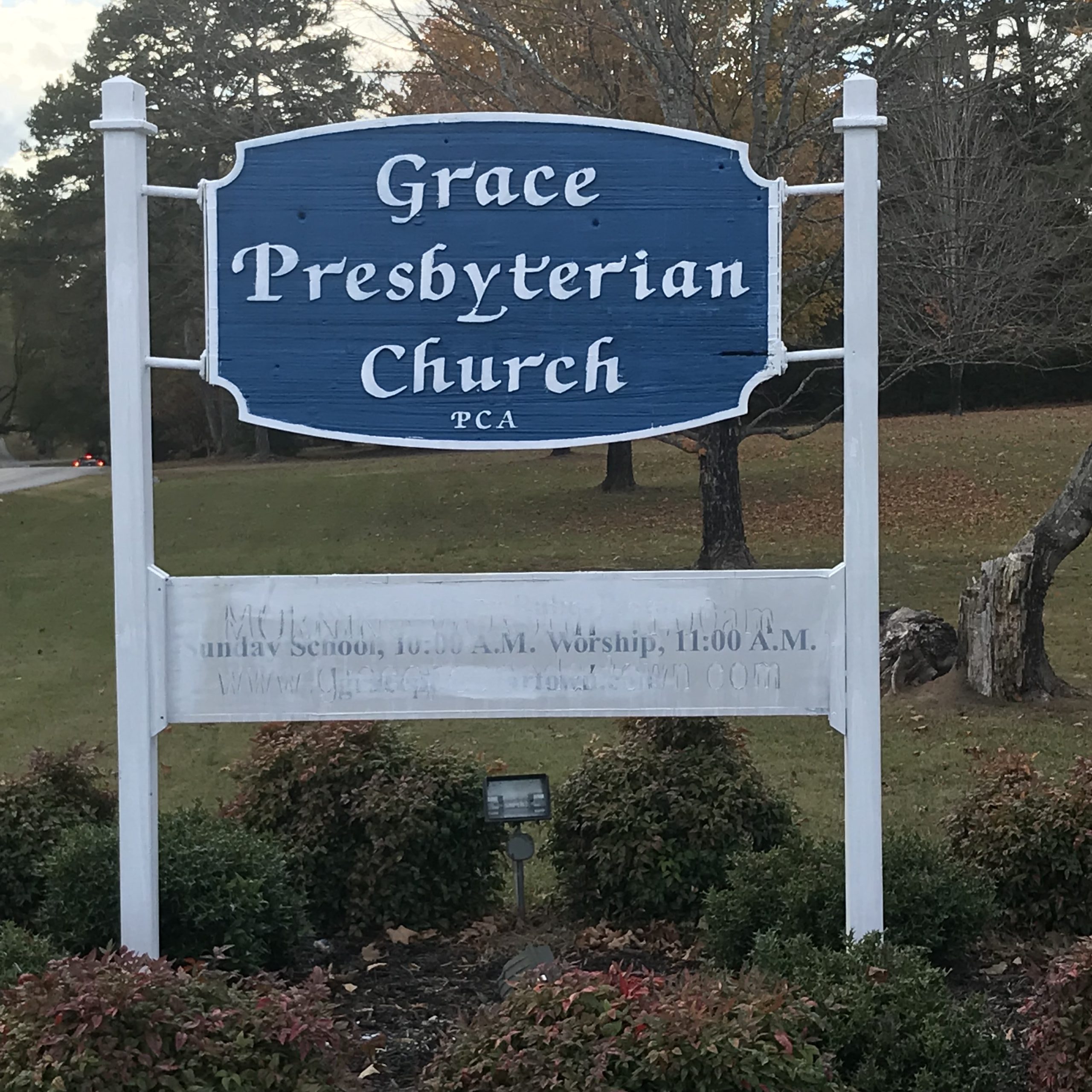 two man and woman standing on doorway